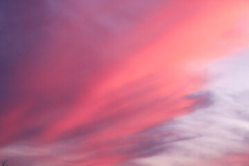 surreal pink clouds in the blue sky abstract background