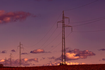 Power line at sunset sky