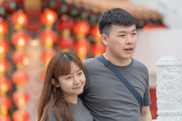 June 2024. A Chinese Malaysian couple in their 30s spends time at a famous Chinese temple popular with tourists in Kuala Lumpur, Malaysia.