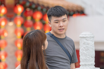 June 2024. A Chinese Malaysian couple in their 30s spends time at a famous Chinese temple popular with tourists in Kuala Lumpur, Malaysia.