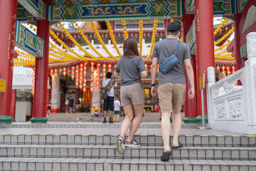 June 2024. A Chinese Malaysian couple in their 30s spends time at a famous Chinese temple popular with tourists in Kuala Lumpur, Malaysia.