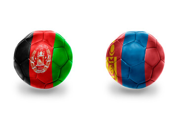 football balls with national flags of mongolia and afghanistan ,soccer teams. on the white...