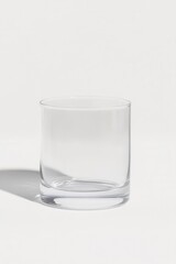 clear glass tumbler on plain background