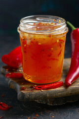 Jar of spicy honey in close-up.