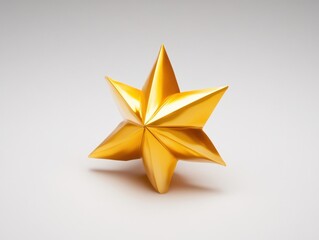 Obraz premium Vibrant golden origami star against a plain background