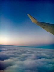 Flying through the clouds during sunset