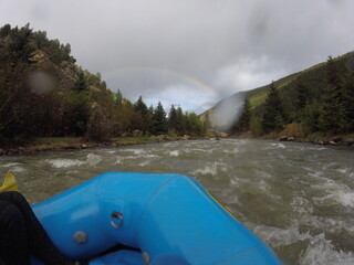 White water rafting in Colorado under a rainbow