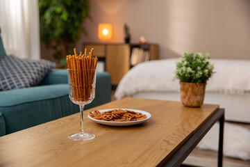 A Cozy Living Room Filled with Delicious Snacks and Beautiful Decor for Your Enjoyment