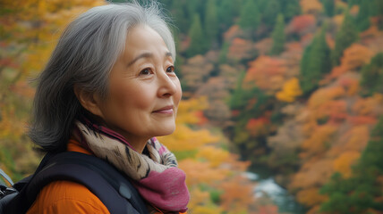 Fototapeta premium 紅葉の渓谷でひとときを過ごす女性