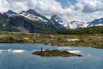 Blue water, ice and mountains in the Alps. Grimsel Pass
