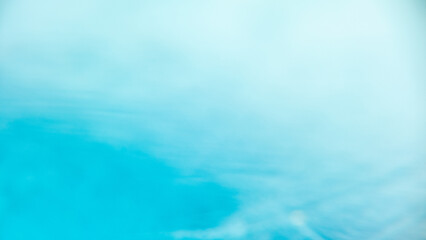 A light blue sky with white clouds