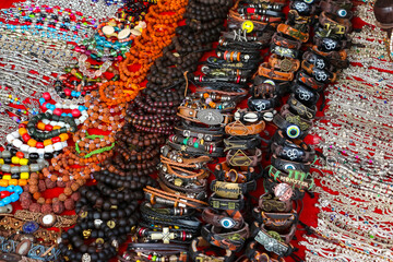 Closeup view of indian traditional handicraft (bracelets) on the street market, Arambol, Goa, India.