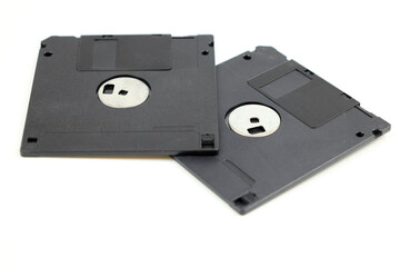 Two floppy disks on white background