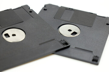 Two floppy disks on white background