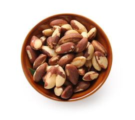 Bowl with tasty Brazil nuts on white background