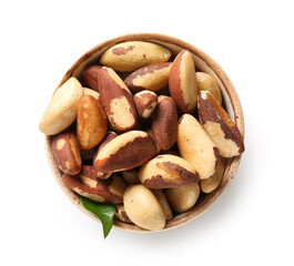 Bowl with tasty Brazil nuts on white background