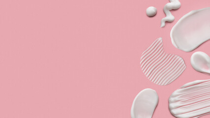 smears of cosmetic product on pink background