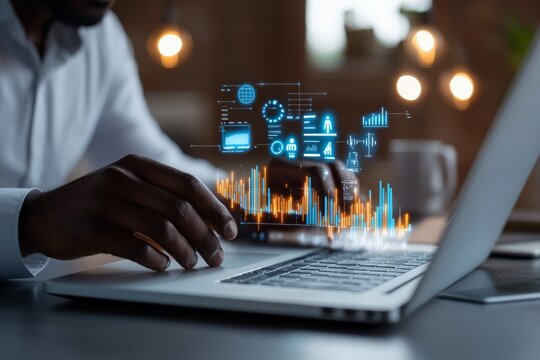 A businessman works on a laptop with a futuristic holographic interface displaying data and various analytics, representing modern technology and innovation.