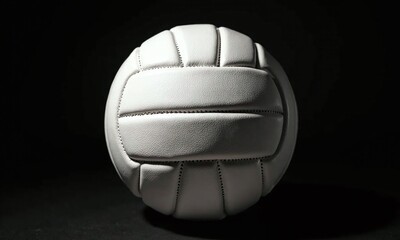 White volleyball black background dramatic lighting high contrast