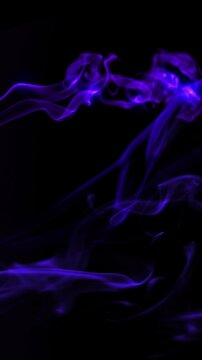 Vertical Purple Glowing Smoke Tendril Wisps 4K Loop features tendrils of purple glowing smoke rising up at an angle against a black background in a vertical ratio loop.