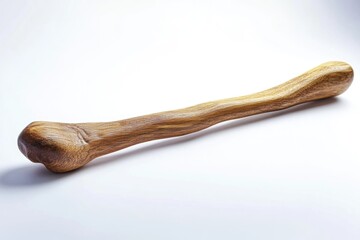 A wooden baseball bat lying on a white surface