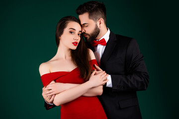 Photo of attractive young man woman couple gentle teasing dressed stylish fancy clothes isolated on green color background