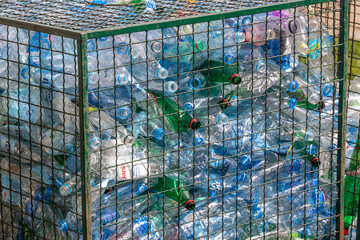 Pile of plastic bottles in a cage