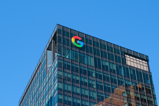 Cambridge, USA - 12 October 2024. modern Google office with logo stands tall against a clear blue sky, innovation and technology.