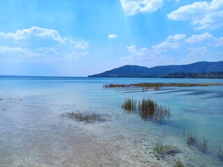 Clear waters and scenic landscape of Lake Peten Itza in El Remate, Peten, Guatemala
