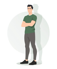 Man in dark green t-shirt and grey trousers standing in a relaxed pose with his hands on his chest. Modern and versatile look for everyday life.