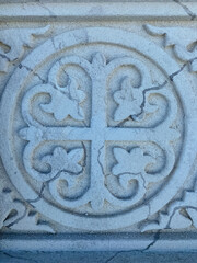 This is a fascinating stone carving featuring a distinct circular shape that is adorned with four beautifully designed hearts located within it, creating an intriguing design