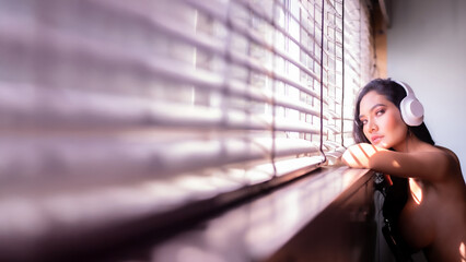 Attractive beautiful woman listening to a podcast