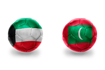 football balls with national flags of maldives and kuwait ,soccer teams. on the white background.