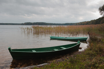 Obraz premium Retro boat in a misty lake. Fog in Shatsky lake, Ukraine. High resolution photo.