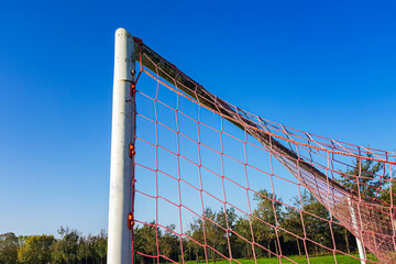 Obraz premium coccer net on blue sky background