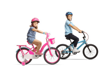 Children riding bicycles with helmets