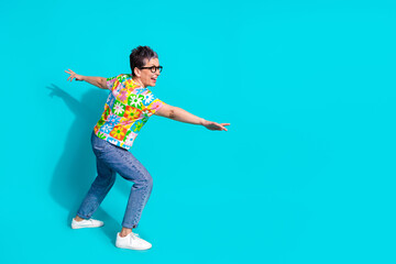 Full length portrait of pretty aged lady dancing empty space ad disolated on turquoise color background