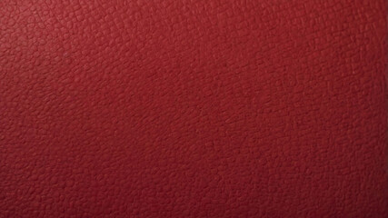 textured synthetic leather surface in a rich, deep red color.