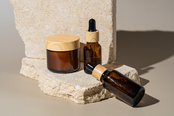 Elegant cosmetic jars on stone podiums in natural light