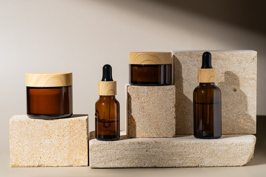 Elegant cosmetic products on natural stone podiums