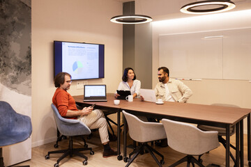 Collaborative Team Meeting in Modern Coworking Space