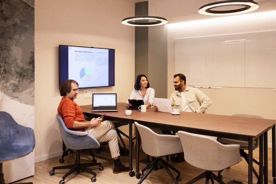 Collaborative Team Meeting in Modern Coworking Space - Powered by Adobe