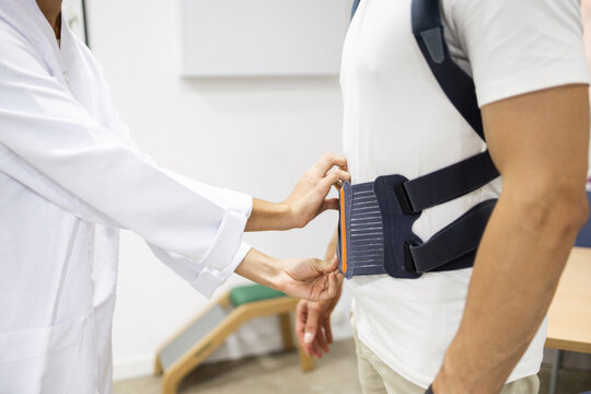 Professional fitting of back brace in orthopedic setting
