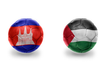 Obraz premium football balls with national flags of palestine and cambodia,soccer teams. on the white background.