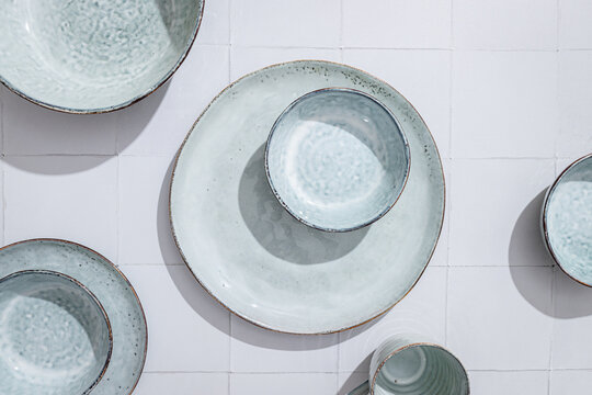 Ceramic tableware in white and blue, shot from above