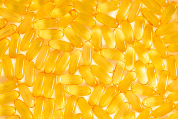 Oil filled capsules, omega, softgel of food supplements, fish oil, omega 3, vitamin D3, vitamin E. Fish oil capsules on white background