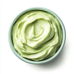 Obraz premium A bowl of creamy avocado dip, isolated on a white background, highlighting a rich, green spread