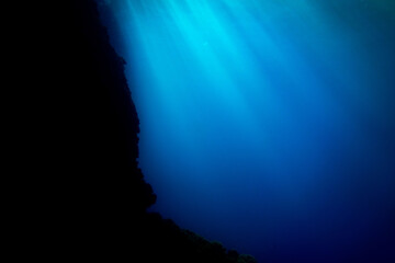 Sun Rays Penetrating the Deep Blue Ocean