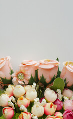 Bouquet of roses on gray background. Vertical image for social media and mobile devices. Soft pink flowers with copy space for valentine, women's day, wedding and mother's day.