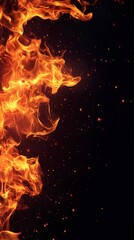 Flame, fire texture with glowing sparks, black background.